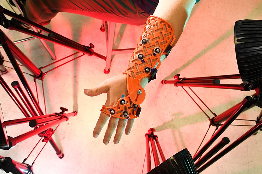 Professor Laurel Kuxhaus works with student Rachel Martin in a lab where they construct limited motion wrist braces